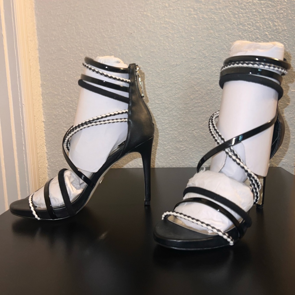 Bebe style name: Ninna, black & white heels size 7 US. Brand new! Never worn.